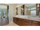 Elegant bathroom with double vanity, large mirror, and modern fixtures at 3598 Fair Oaks Ln, Longboat Key, FL 34228