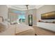 Spacious bedroom with water views and hardwood floors at 3598 Fair Oaks Ln, Longboat Key, FL 34228