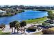 Peaceful golf course with palm trees and water at 3598 Fair Oaks Ln, Longboat Key, FL 34228