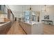 Large kitchen island with white quartz countertops and modern cabinetry at 3598 Fair Oaks Ln, Longboat Key, FL 34228