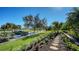 Landscaped yard with stone pathway and lush tropical foliage at 3598 Fair Oaks Ln, Longboat Key, FL 34228