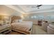 Spacious main bedroom with a sitting area and large windows at 3598 Fair Oaks Ln, Longboat Key, FL 34228