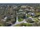 Aerial view of a beautiful estate nestled in a lush, green neighborhood with mature trees at 3709 Beneva Oaks Way, Sarasota, FL 34238