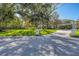 House nestled on a spacious lot with lush landscaping at 3709 Beneva Oaks Way, Sarasota, FL 34238