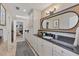 Elegant bathroom with double vanity, granite countertop and a view to the bedroom at 3709 Beneva Oaks Way, Sarasota, FL 34238