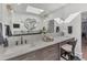 Spa-like bathroom with a double vanity, marble countertop and a large mirror at 3709 Beneva Oaks Way, Sarasota, FL 34238