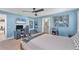 Blue bedroom with a bed, gaming setup, and a fish tank at 3709 Beneva Oaks Way, Sarasota, FL 34238