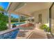 Hot tub with view of pool, patio, and backyard at 3709 Beneva Oaks Way, Sarasota, FL 34238