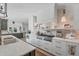 White kitchen with marble backsplash and professional range at 3709 Beneva Oaks Way, Sarasota, FL 34238