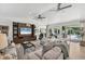 Living room with sliding doors leading to a pool and backyard at 3709 Beneva Oaks Way, Sarasota, FL 34238