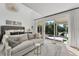 Main bedroom features a sitting area and sliding doors to the backyard at 3709 Beneva Oaks Way, Sarasota, FL 34238