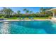 Inviting pool area with lounge chairs and lush landscaping at 3709 Beneva Oaks Way, Sarasota, FL 34238