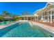 Stunning pool with lounge chairs and manicured deck, perfect for outdoor relaxation and entertaining at 3709 Beneva Oaks Way, Sarasota, FL 34238