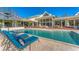 Relaxing poolside view with comfortable lounge chairs at 3709 Beneva Oaks Way, Sarasota, FL 34238