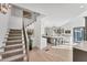 Modern staircase with light wood and metal railings, overlooking the kitchen at 3709 Beneva Oaks Way, Sarasota, FL 34238