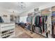 Custom walk-in closet with hardwood floors and shelving maximizes storage space at 3709 Beneva Oaks Way, Sarasota, FL 34238