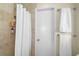 Clean bathroom with shower and white tile at 372 Tihami Rd, Venice, FL 34293