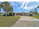 Ranch-style home with a two-car garage and well-maintained landscaping at 372 Tihami Rd, Venice, FL 34293