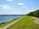 Scenic pathway at Nathan Benderson Park alongside a lake and lush green landscape at 3822 Ironwood Ct, Sarasota, FL 34243