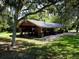 Spacious covered pavilion with picnic tables and green space, ideal for community events and outdoor gatherings at 3822 Ironwood Ct, Sarasota, FL 34243