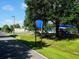 Park sign with playground, tennis courts, and parking information along paved walkway at 3822 Ironwood Ct, Sarasota, FL 34243