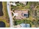 Bird's eye view of a luxurious home and its beautifully landscaped surroundings at 3927 Founders Club Dr, Sarasota, FL 34240