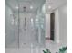 Luxurious bathroom with a large walk-in shower and marble flooring at 3927 Founders Club Dr, Sarasota, FL 34240