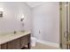 Clean bathroom with a toilet, vanity sink, and glass shower at 3927 Founders Club Dr, Sarasota, FL 34240