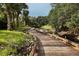 Scenic boardwalk winding along a tranquil waterway at 3927 Founders Club Dr, Sarasota, FL 34240