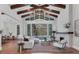 Spacious living area with high ceilings, fireplace, and pool access at 3927 Founders Club Dr, Sarasota, FL 34240