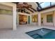 Covered patio with pool and fountain, offering an outdoor oasis at 3927 Founders Club Dr, Sarasota, FL 34240