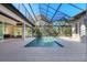 Inviting swimming pool with a covered patio and screened enclosure at 3927 Founders Club Dr, Sarasota, FL 34240