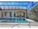 Inviting pool and spa with covered lanai and views of the backyard at 3927 Founders Club Dr, Sarasota, FL 34240