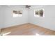 Bedroom featuring neutral walls, new flooring, recessed lighting, and two windows at 3952 Coleridge Pl, Sarasota, FL 34241