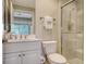 Clean bathroom with shower, toilet and vanity at 401 N Point Rd # 401, Osprey, FL 34229