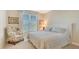 Bedroom with a queen bed and sitting area at 401 N Point Rd # 401, Osprey, FL 34229