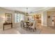 Elegant dining room with a charming chandelier and kitchen access at 401 N Point Rd # 401, Osprey, FL 34229