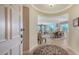 Elegant entryway with view of living and dining areas at 401 N Point Rd # 401, Osprey, FL 34229