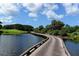 Wooden bridge over water on golf course at 401 N Point Rd # 401, Osprey, FL 34229