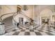 Elegant lobby with grand staircase and checkered floor at 401 N Point Rd # 401, Osprey, FL 34229