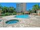 Resort-style pool and spa with a spacious patio and lush landscaping at 401 N Point Rd # 401, Osprey, FL 34229