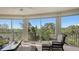 Relaxing screened balcony overlooking scenic wooded area at 401 N Point Rd # 401, Osprey, FL 34229