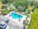 Aerial view of community pool with surrounding lounge chairs and landscaping at 4121 Deep Creek Ter, Parrish, FL 34219