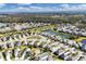 Aerial view of Silverleaf community, showcasing numerous homes, lakes, and lush landscaping at 4121 Deep Creek Ter, Parrish, FL 34219