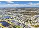 Aerial view of a large residential community with houses, roads, and a lake at 4121 Deep Creek Ter, Parrish, FL 34219