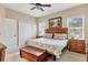 Spacious primary bedroom with a king-size bed and ample closet space at 4121 Deep Creek Ter, Parrish, FL 34219