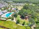 Aerial view of community pool, playground, and residential homes at 4121 Deep Creek Ter, Parrish, FL 34219