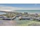 Aerial view of waterfront community; ocean, lush greenery, and buildings visible at 4350 Chatham Dr # E106, Longboat Key, FL 34228