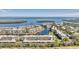 Aerial view of waterfront community; buildings, canal, and ocean visible at 4350 Chatham Dr # E106, Longboat Key, FL 34228