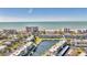 Aerial view of waterfront community; ocean, beach, and buildings visible at 4350 Chatham Dr # 106, Longboat Key, FL 34228